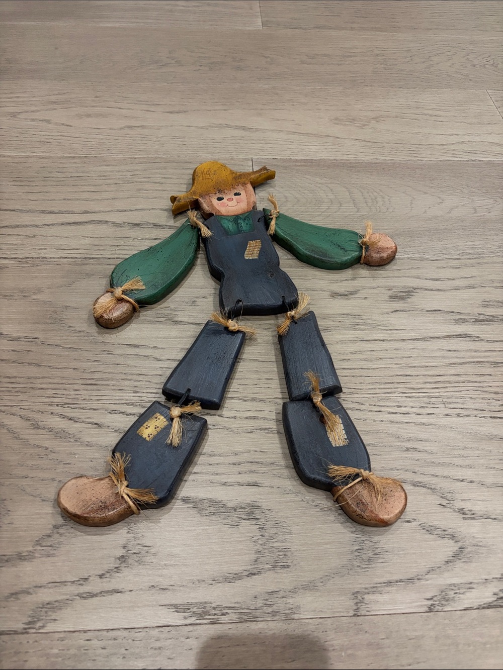 Handcrafted Wooden Scarecrow Wall Accent in Green and Black